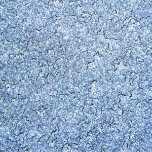 Close-up blue cracked paint texture on rough surface, high-resolution abstract background for design and photography projects